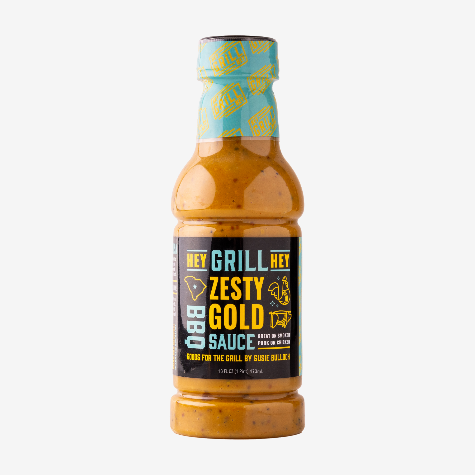 A bottle of Zesty Gold BBQ Sauce over a white background. 